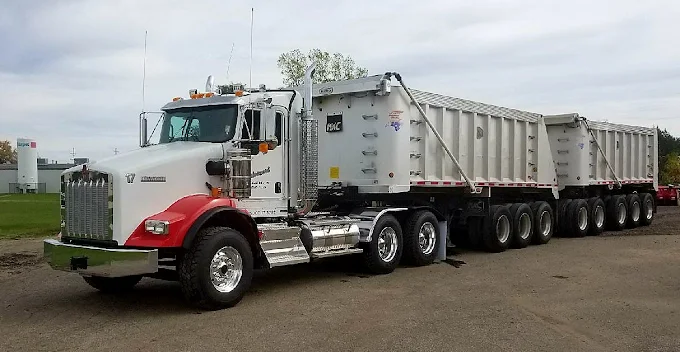 Advanced Excavating's classic Kenworth W900 tractor, polished chrome and red fenders