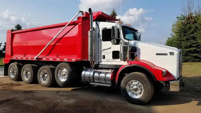 Red and white Kenworth T800 quad-axle dump truck, unit 16