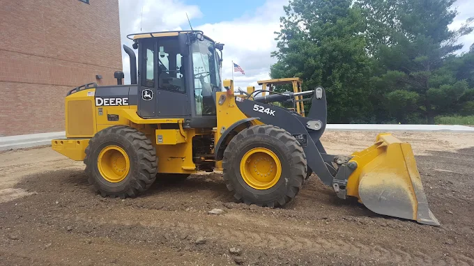 John Deere 524K wheel loader on a graded pad