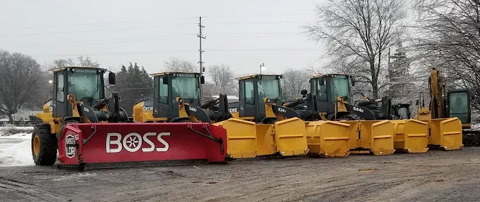 John Deere loaders fitted with BOSS snow plows and salt boxes, ready for winter